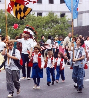 You're both in the picture.  All of the kids carried flags, and the military men saluted when we walked by.